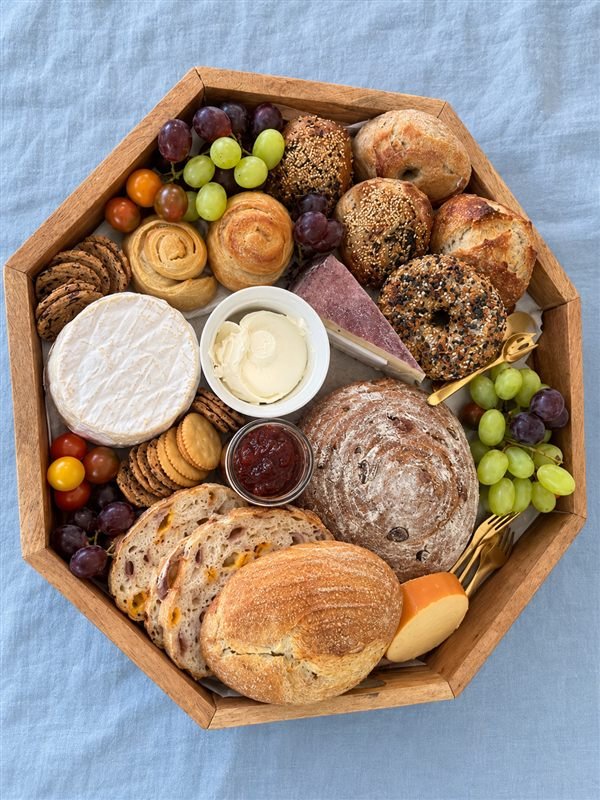 Catering Charcuterie board with artisan breads, cheeses, fruits, and accompaniments